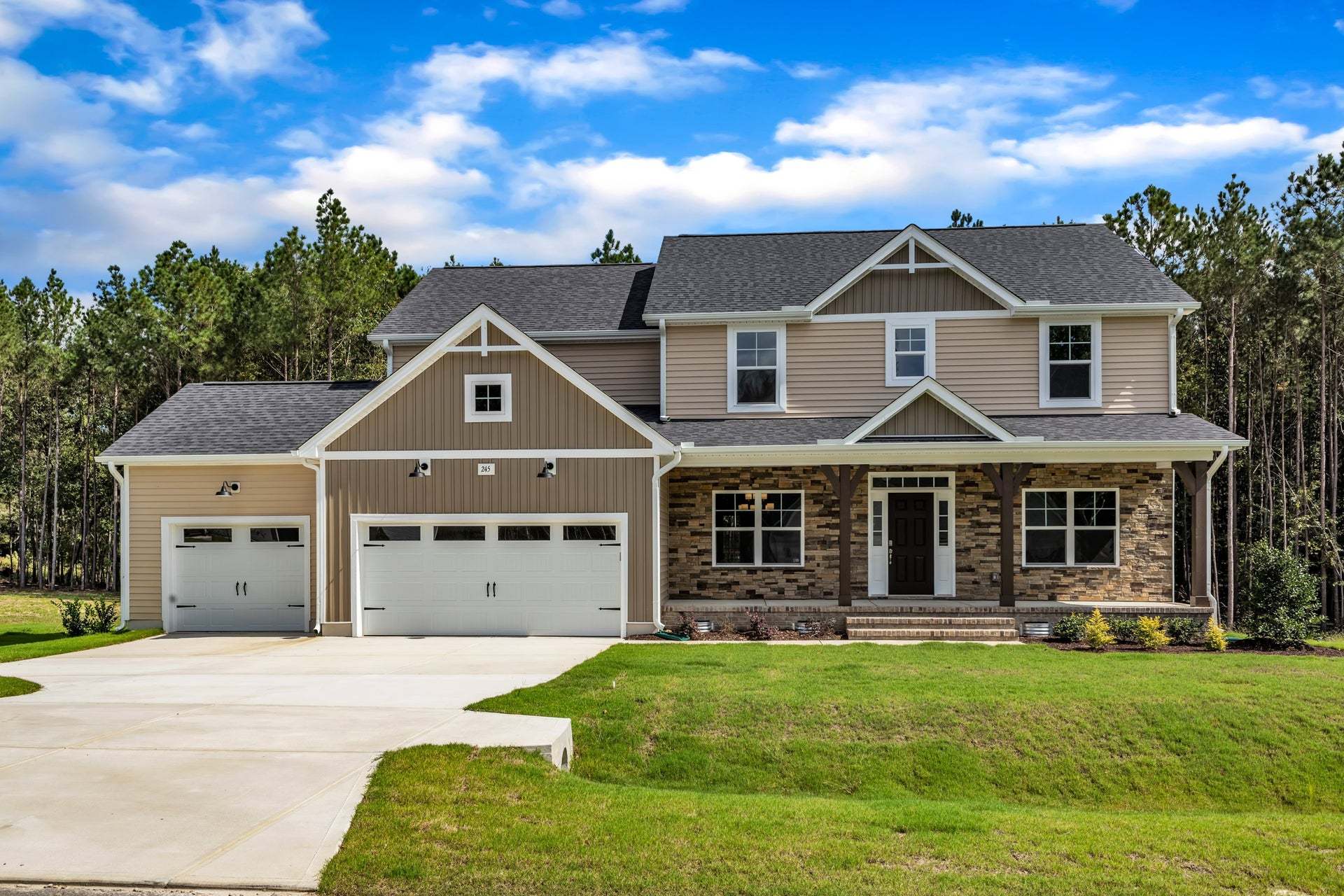 Elevation F with Stone with 3-Car Garage Option