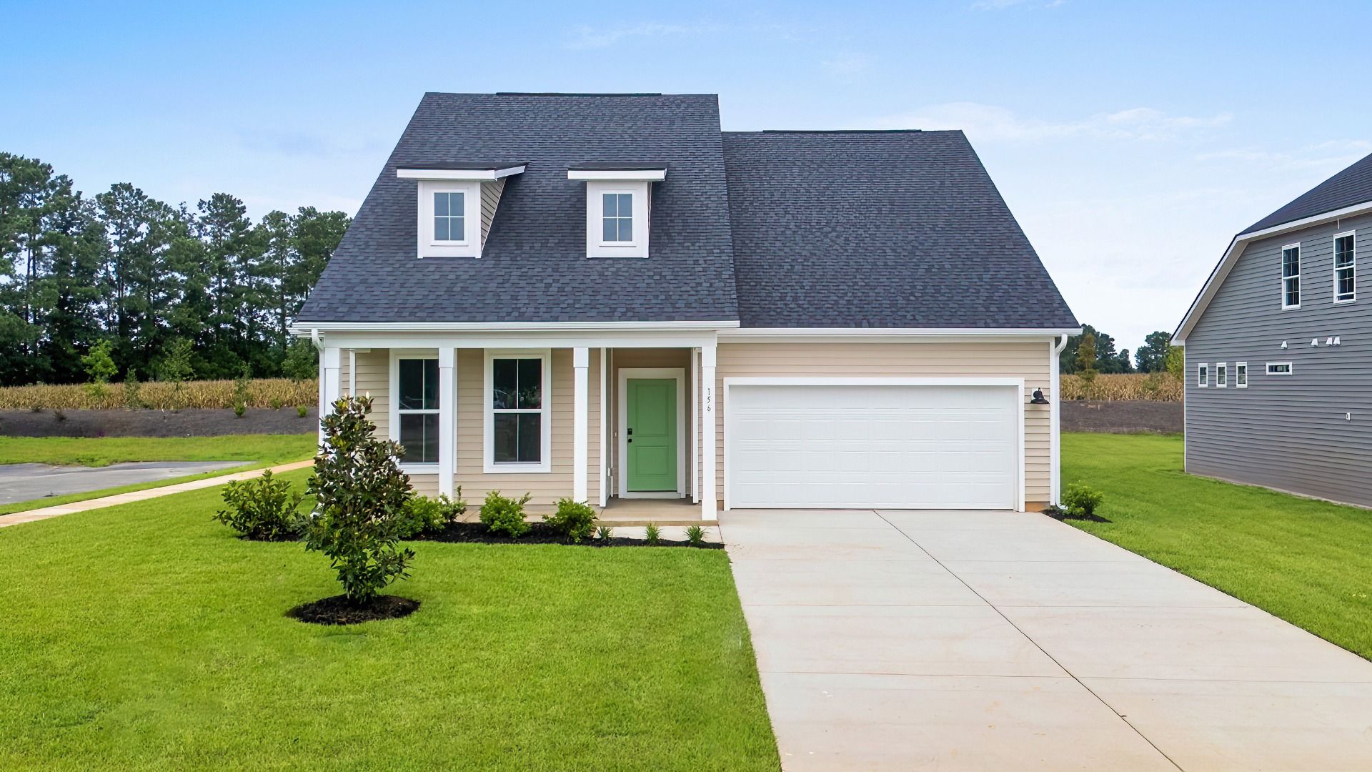 Avondale Elevation 4 at Chestnut Farms in Longs, SC showcasing charming dormers, front porch, and two-car garage