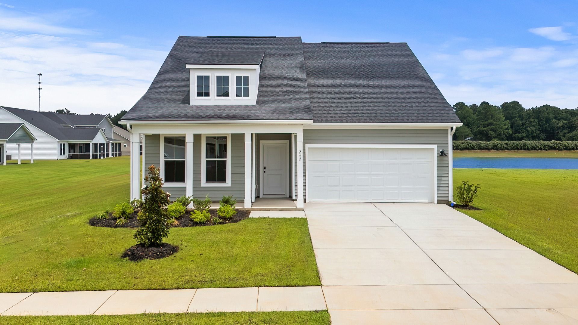 Chelsea Elevation 4 at Chestnut Farms in Longs, SC with front porch and upper-level window detail