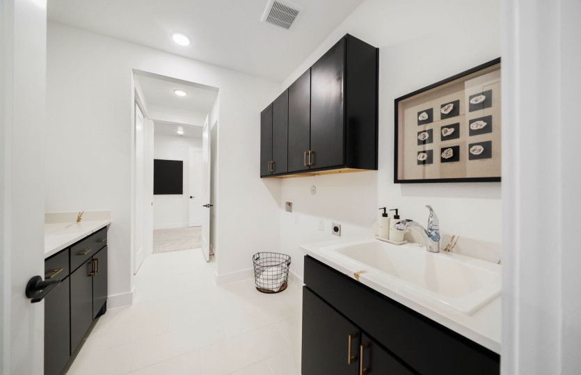 Laundry Room with Base Cabinets and Utility Sink
