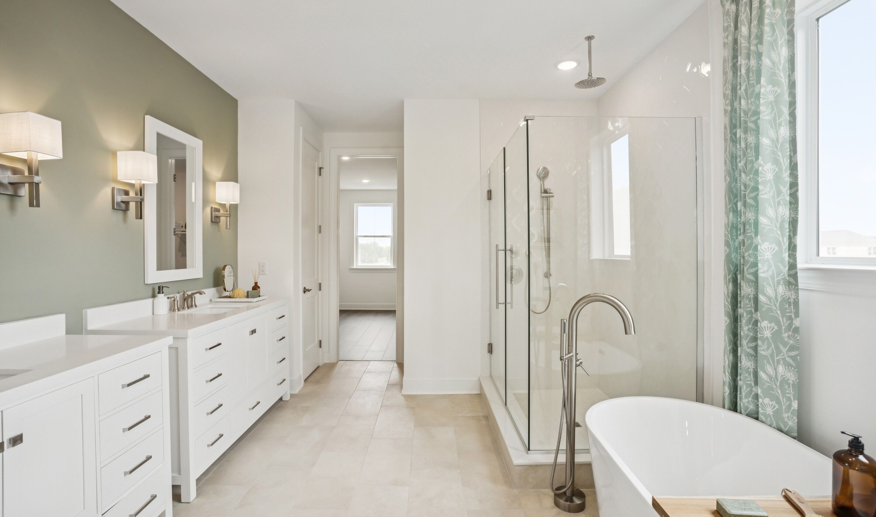 Glass shower enclosure and freestanding tub in primary bath