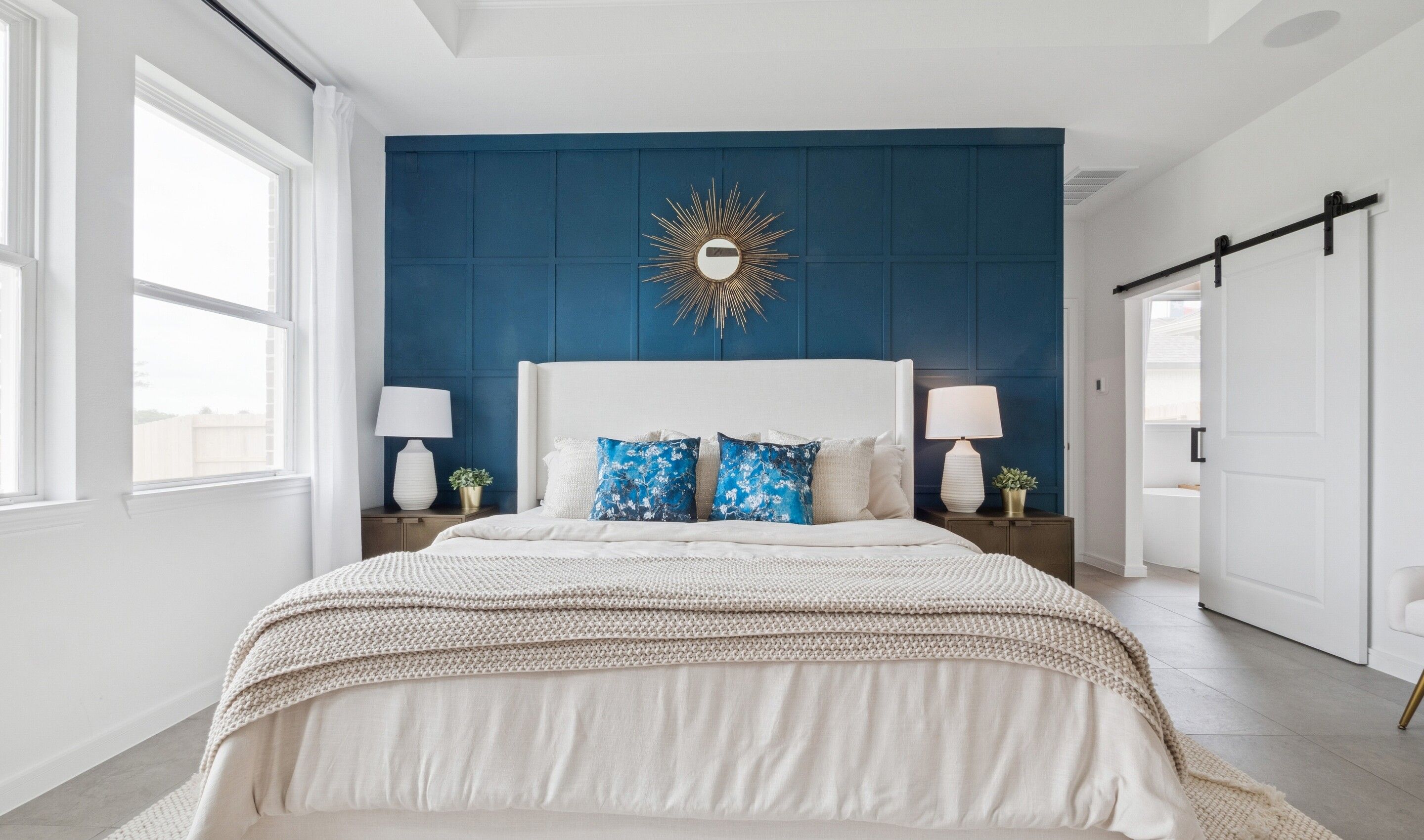 Primary suite with sliding barn door to private bath