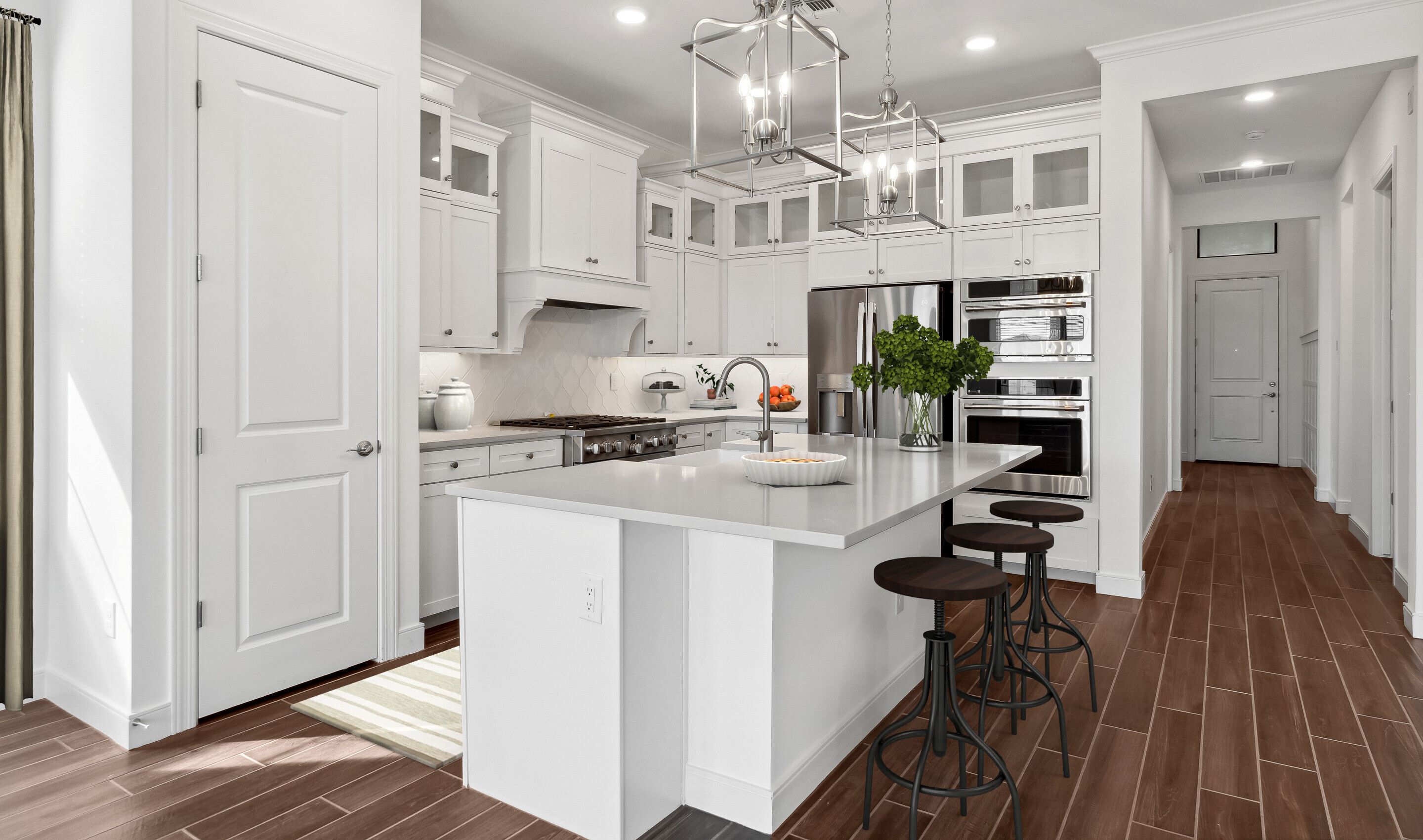 Pendant lighting and gorgeous white cabinets
