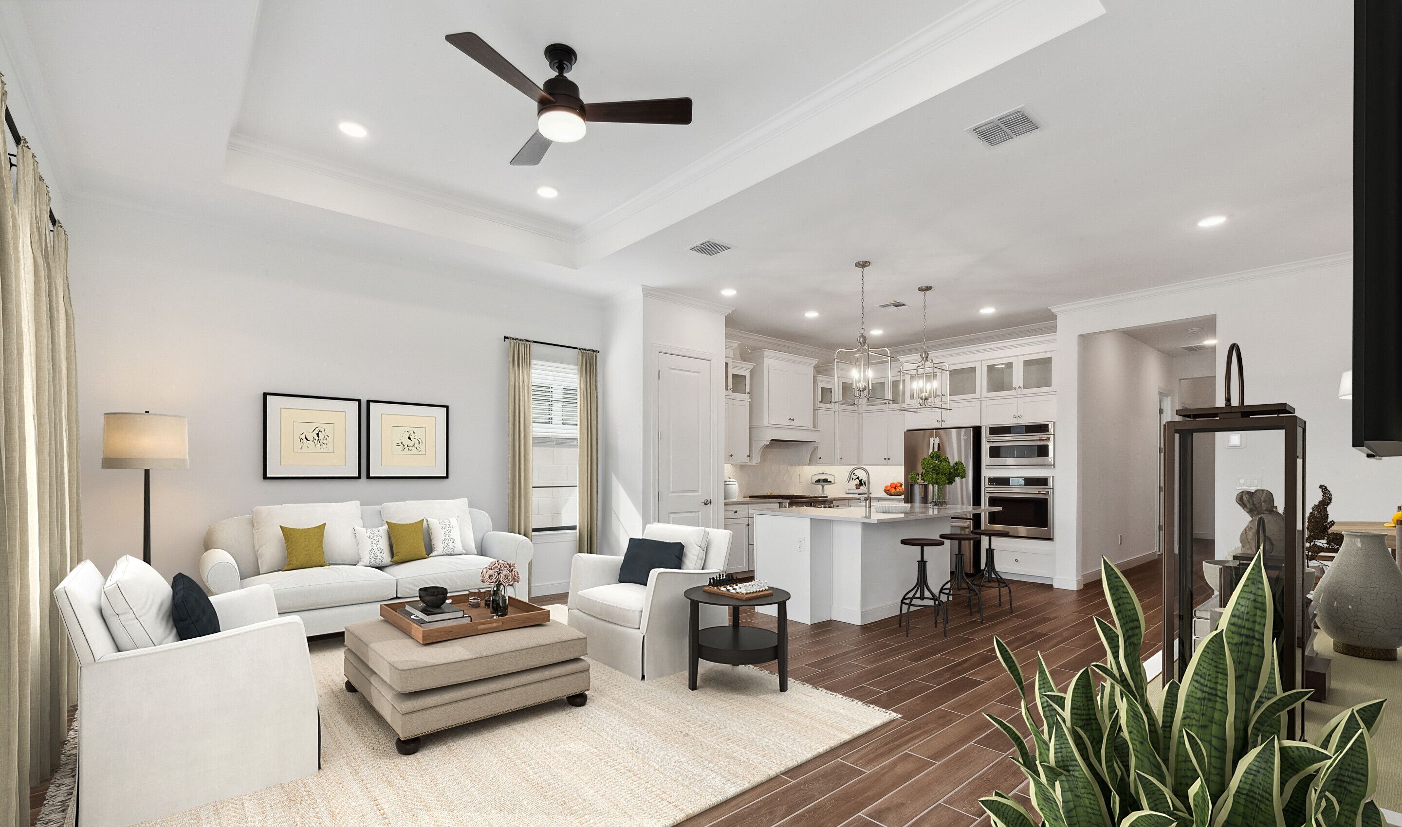 Great room with tray ceiling and luxurious flooring