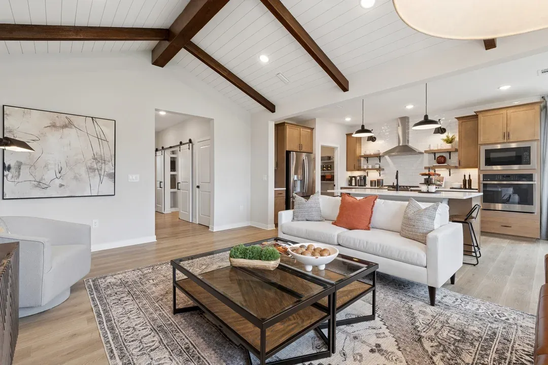Great room with stained ceiling beams