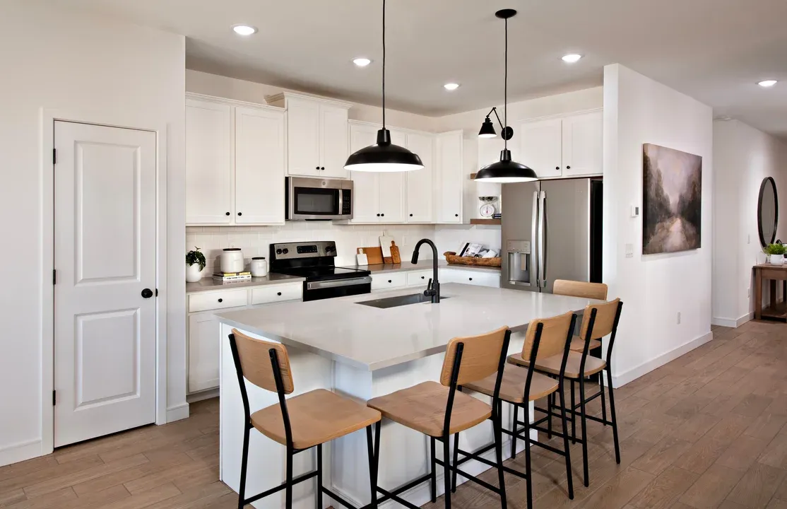 Kitchen with pendant lighting and floating shelves