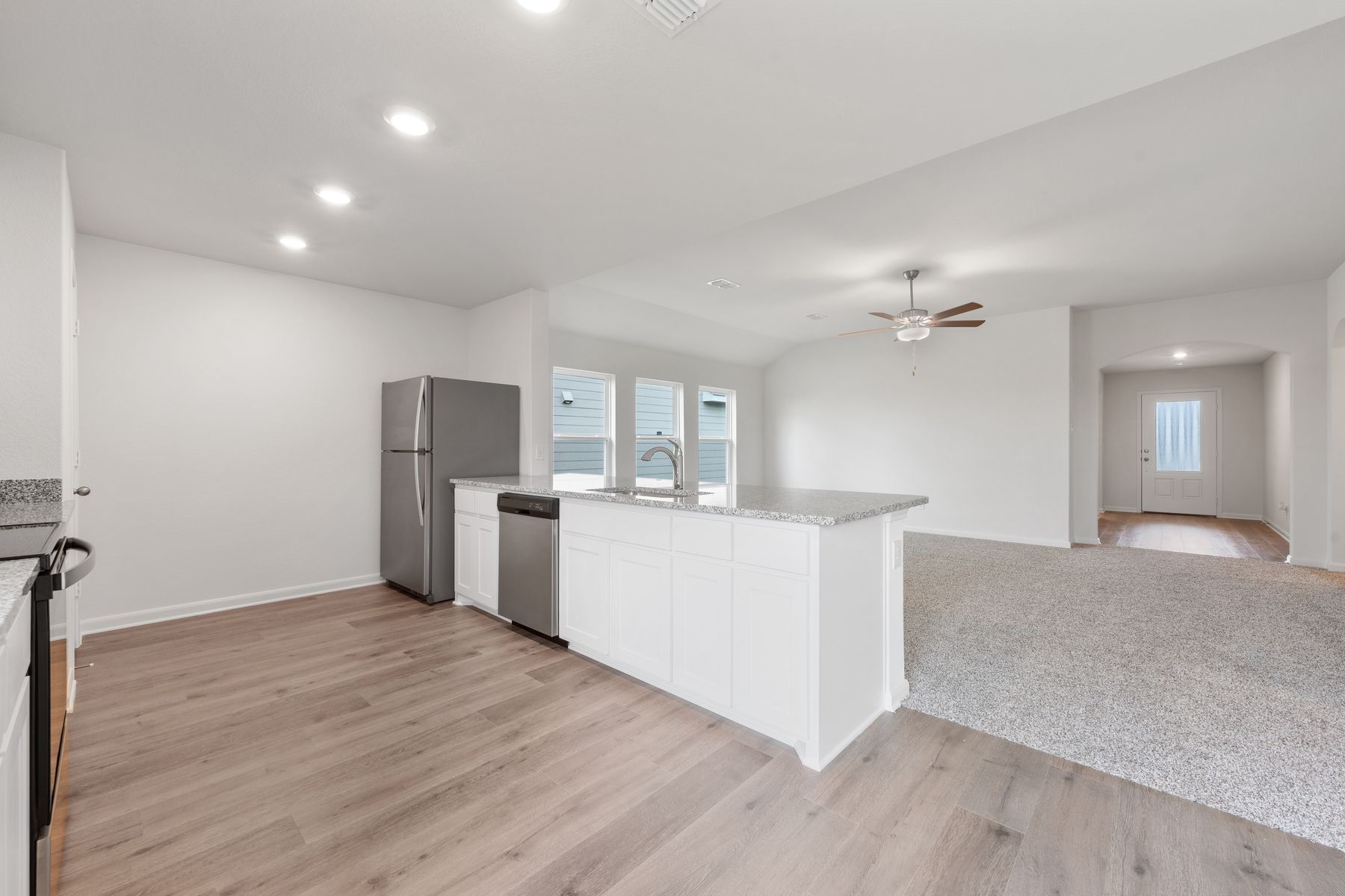 The family room of the Reed  sits adjacent to the kitchen.