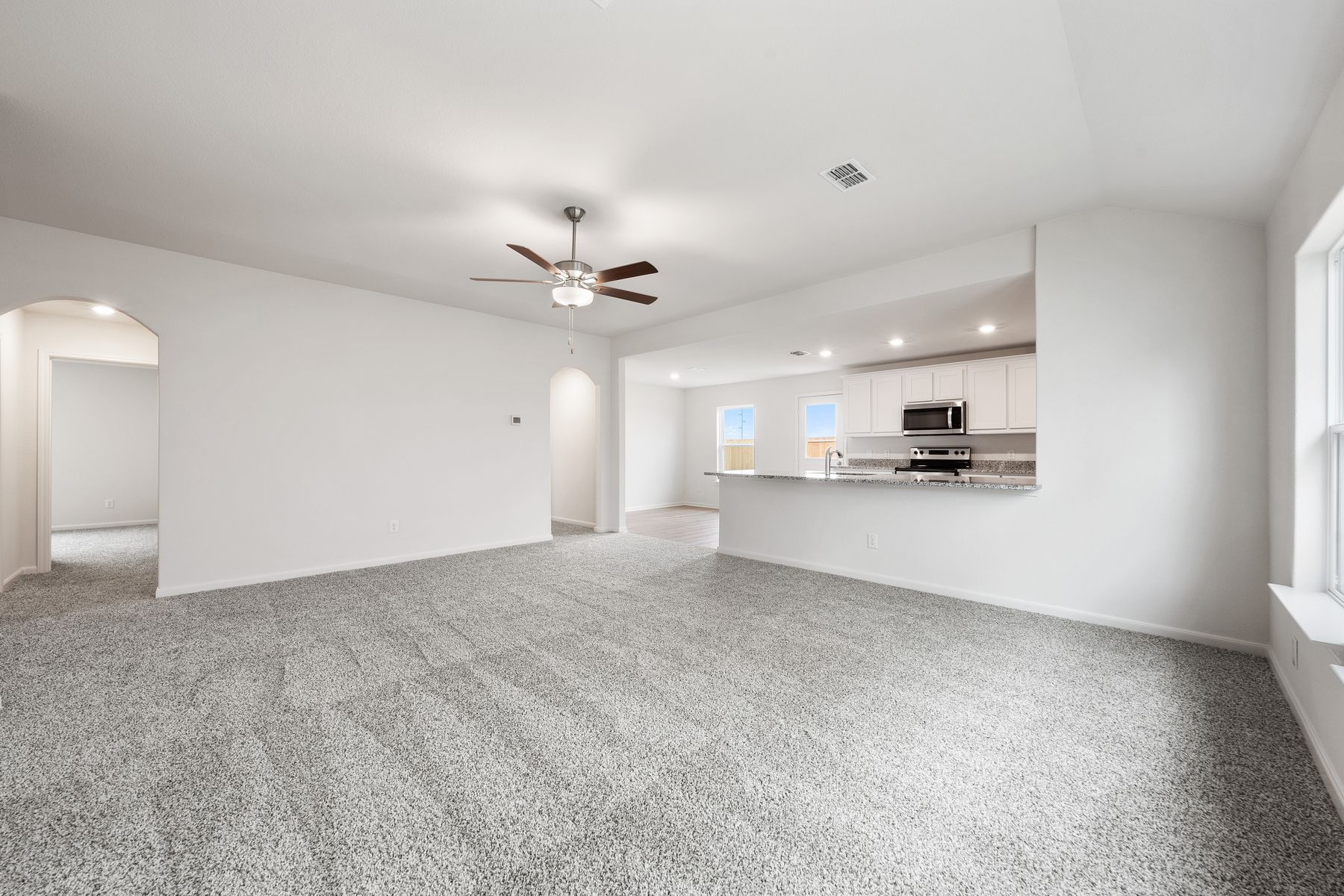 The Reed  floor plan has an open-concept layout.