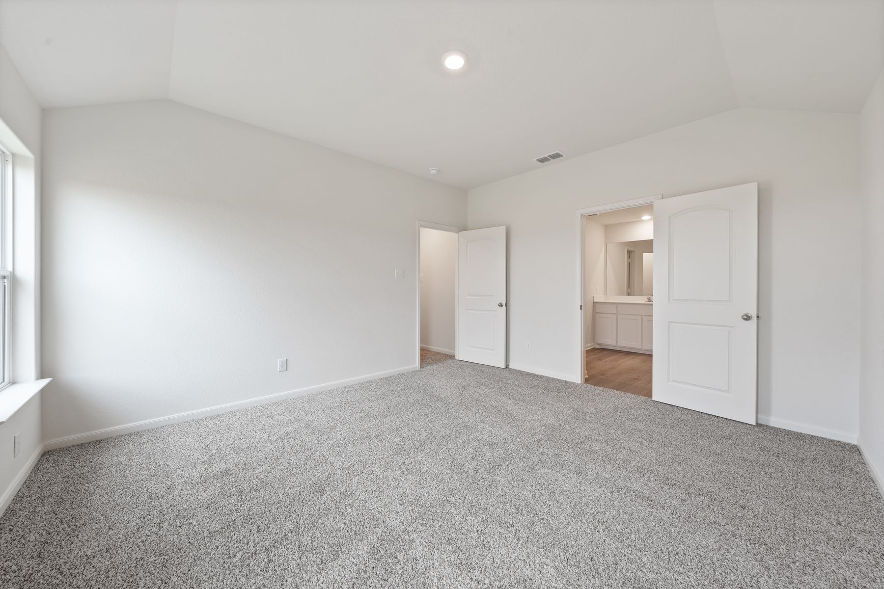 The master suite of the Reed  has a large bedroom, private bathroom and walk-in closet.
