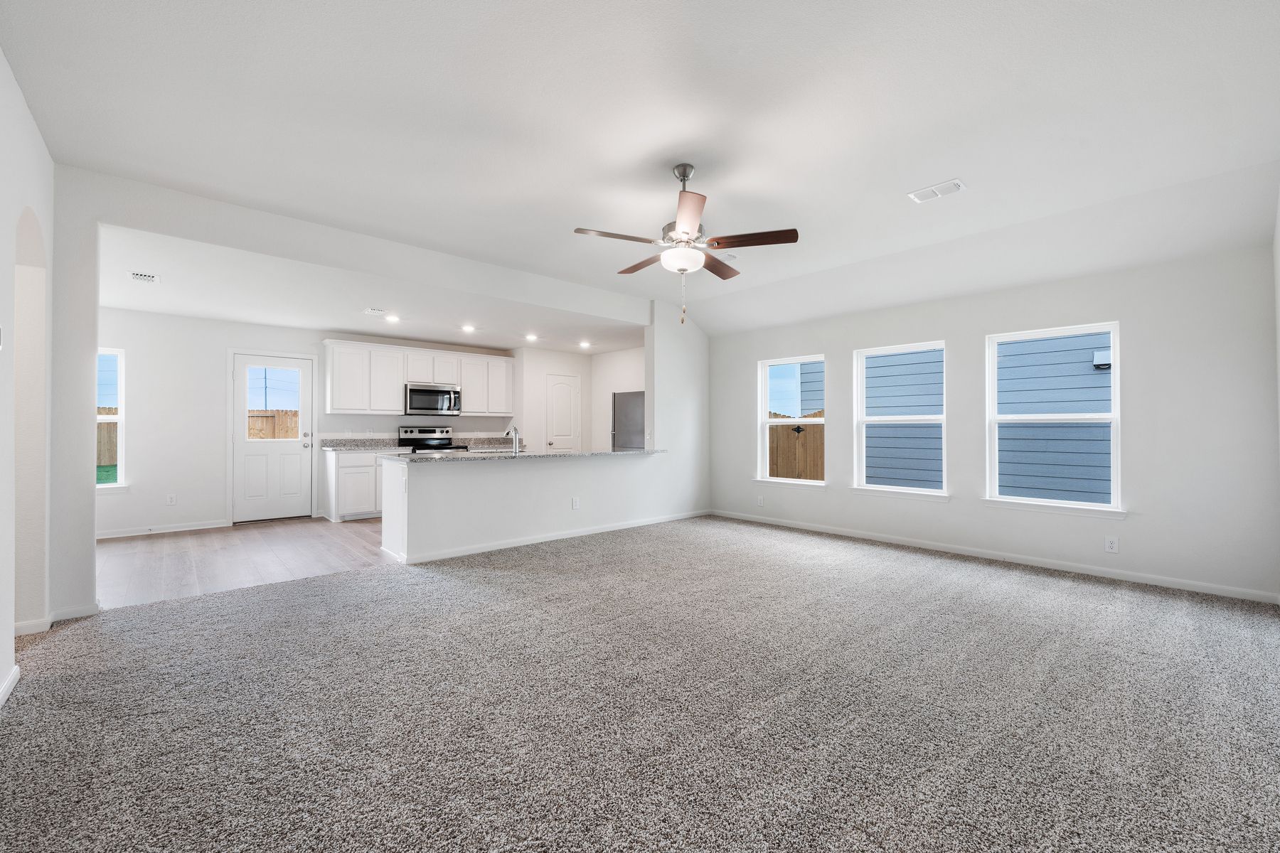 The family room of the Reed  is large, and has three windows that let in great, natural light.