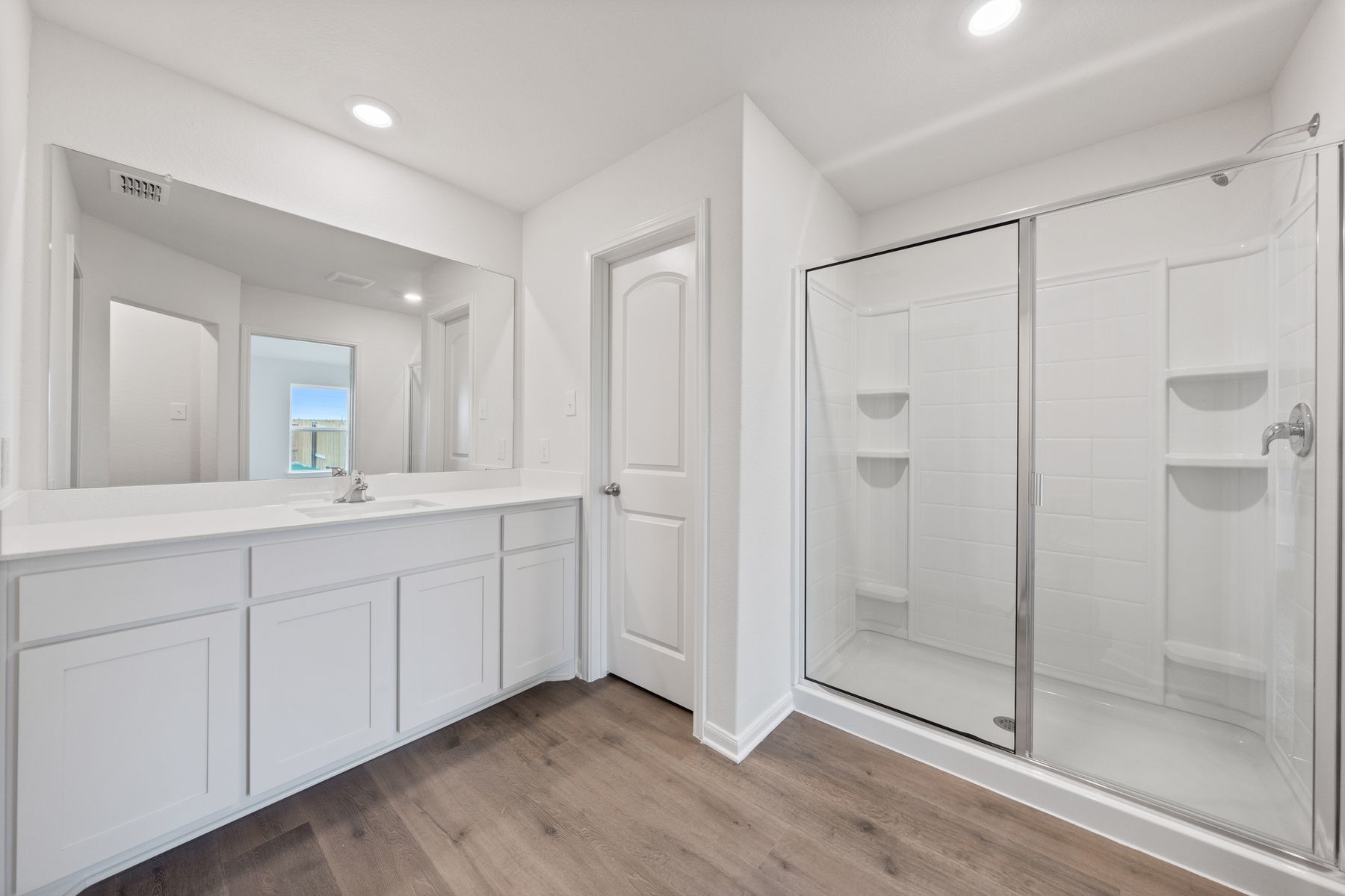 The master bathroom of the Reed  has a large vanity with plenty of counterspace.