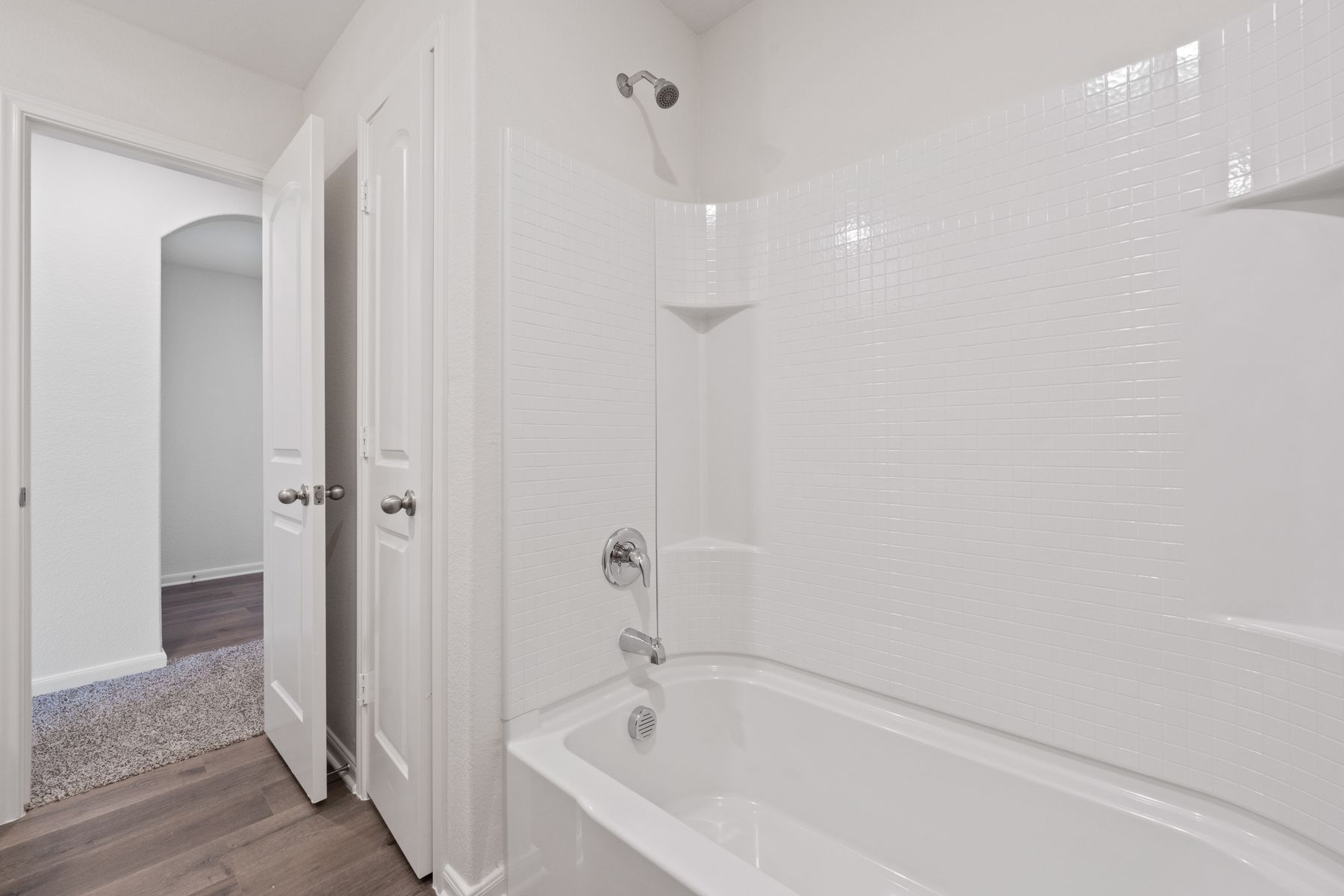 The secondary bathroom of the Reed has a shower-tub combo.