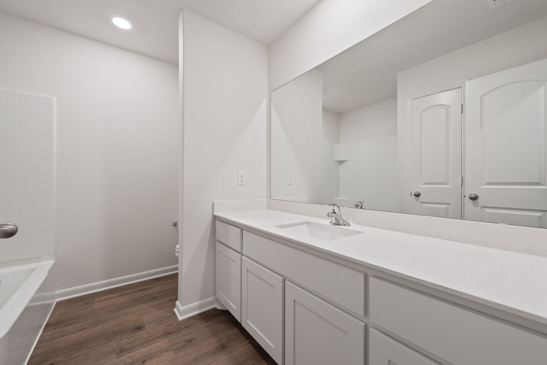 The secondary bathroom of the Reed has a large vanity with plenty of counterspace.