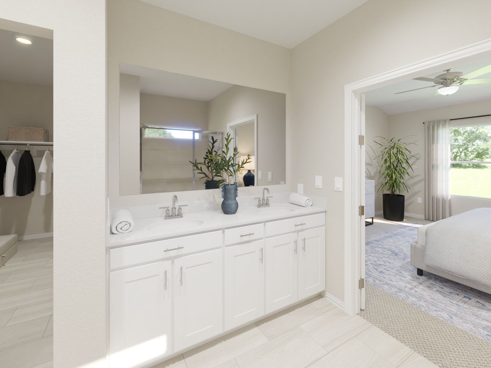 Primary bathroom with double vanity and large walk-in closet