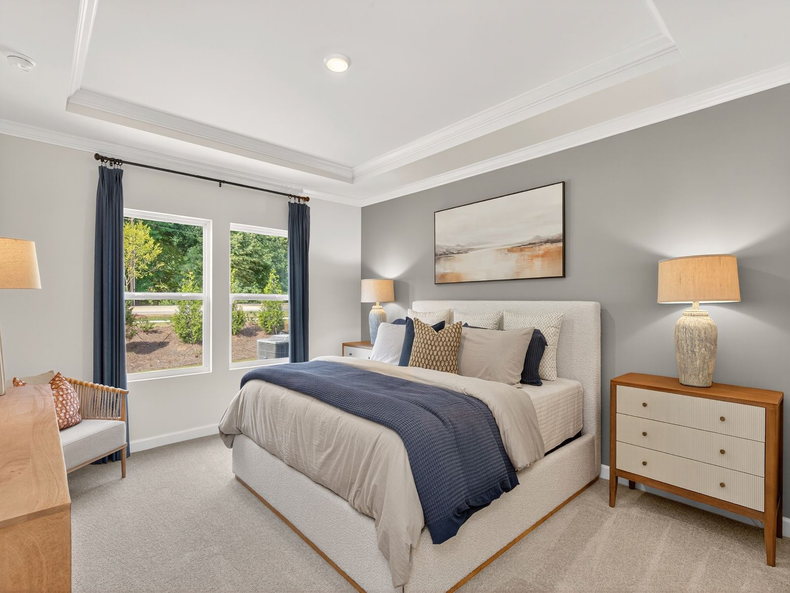 Relax and unwind after a long day in the downstairs primary bedroom.