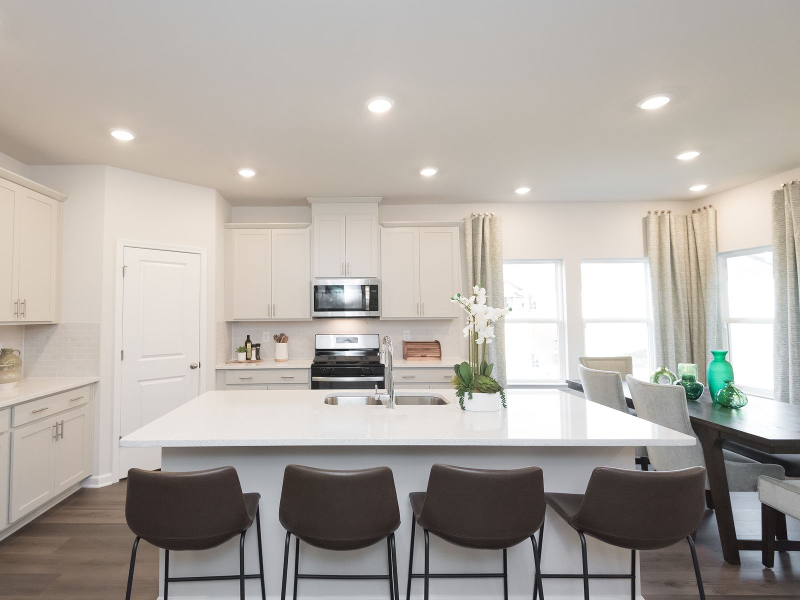 The spacious kitchen island overlooks the dining area and great room.
