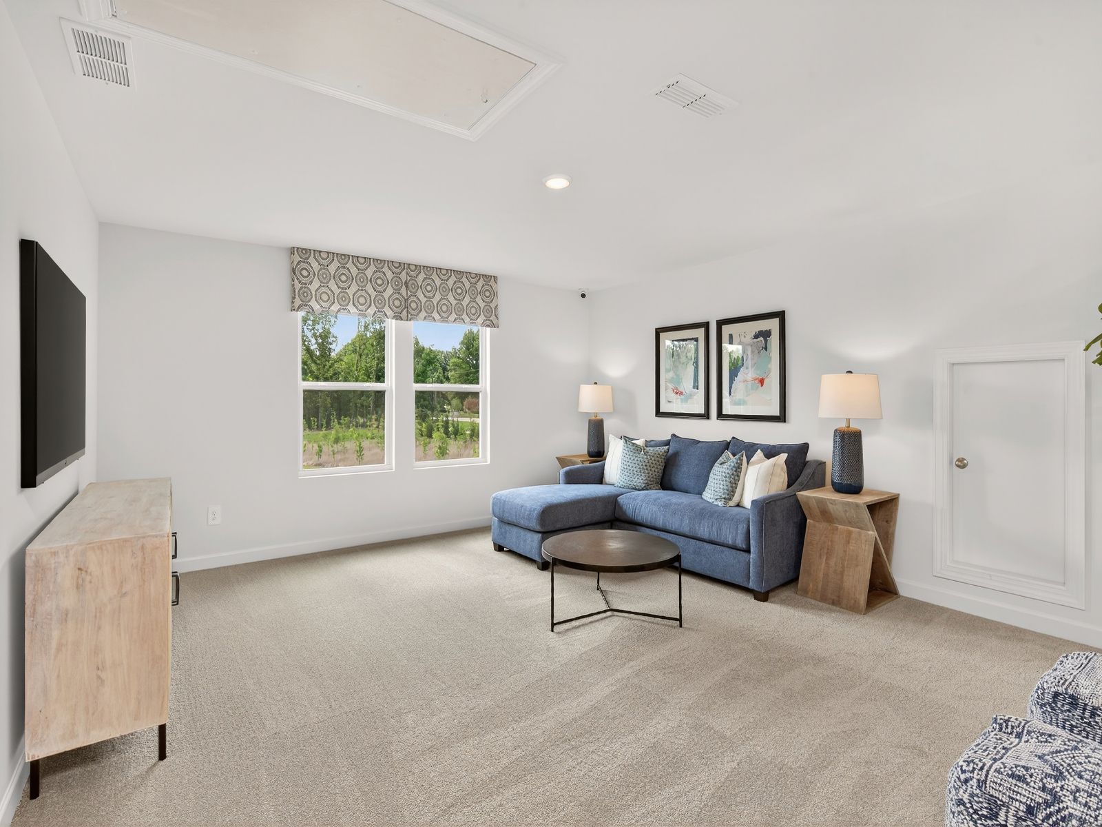 The upstairs loft is perfect for a lounge area or movie room.