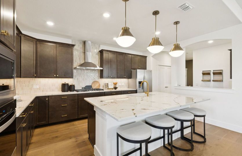 Recessed and pendant lighting in kitchen