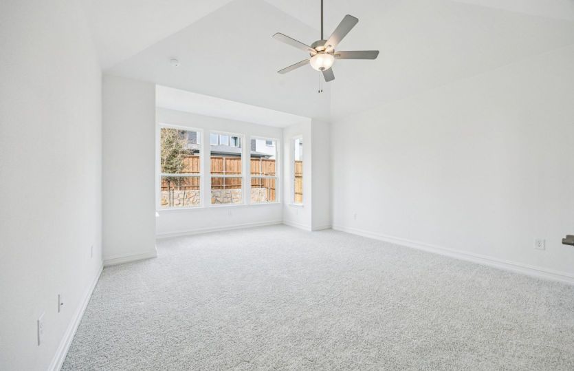 Spacious owner's suite showing optional vaulted ceiling *photos may depict options and features that