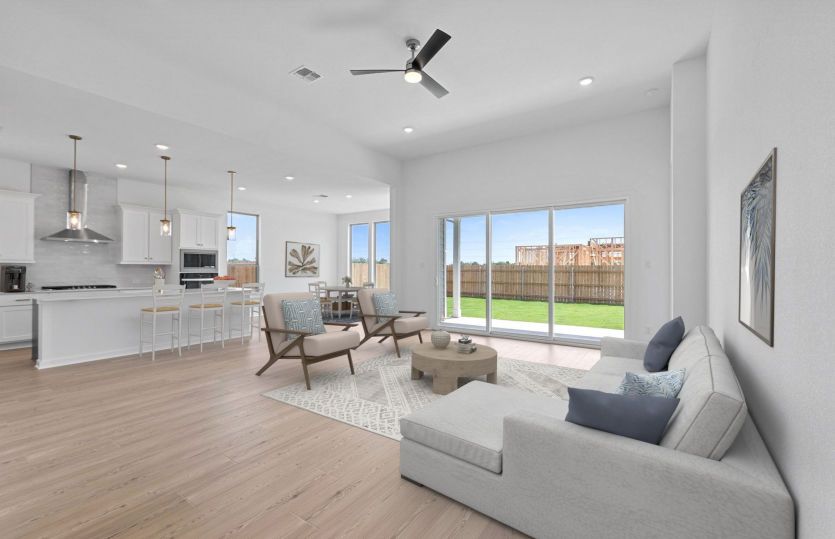 Spacious gathering room in the Boling floorplan with open-concept design and abundant natural light.