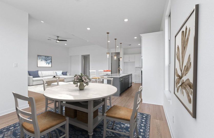 Modern kitchen in the Boling floorplan with spacious island and seamless flow to the gathering room.