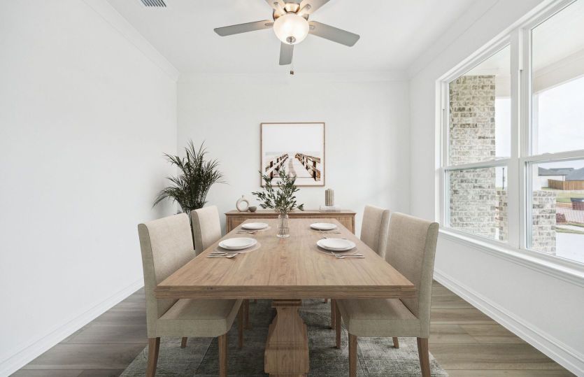 Elegant dining room in the Azle floorplan with easy access to the kitchen.