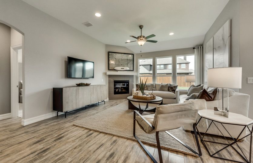 Gathering room surrounded by windows with gorgeous optional fireplace