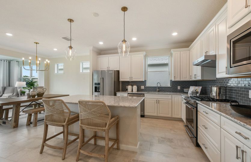 Kitchen opens up to café dining space