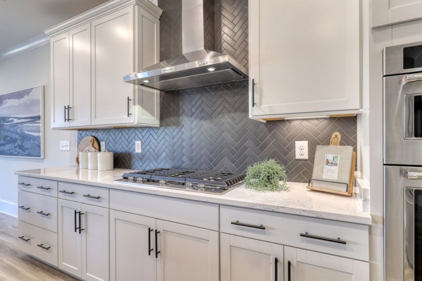 High-performance stainless steel stove in a modern chef-inspired kitchen.