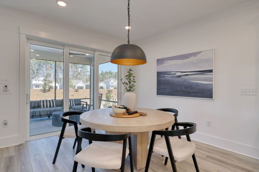 Bright café-style seating area perfect for casual dining and morning coffee.