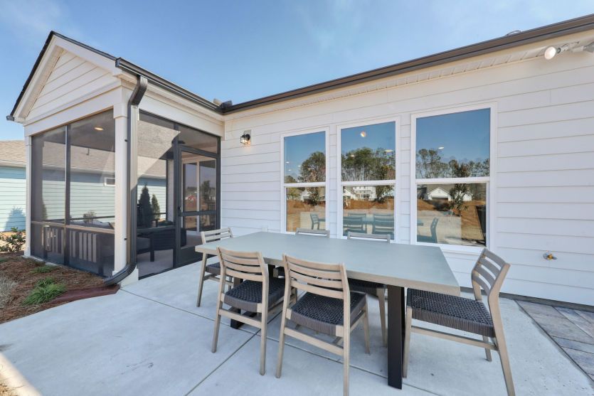 Expansive outdoor patio ideal for dining and relaxing outdoors.