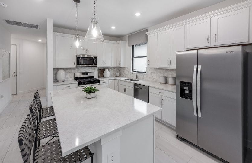 Kitchen with large center island and stainless steel appliances
