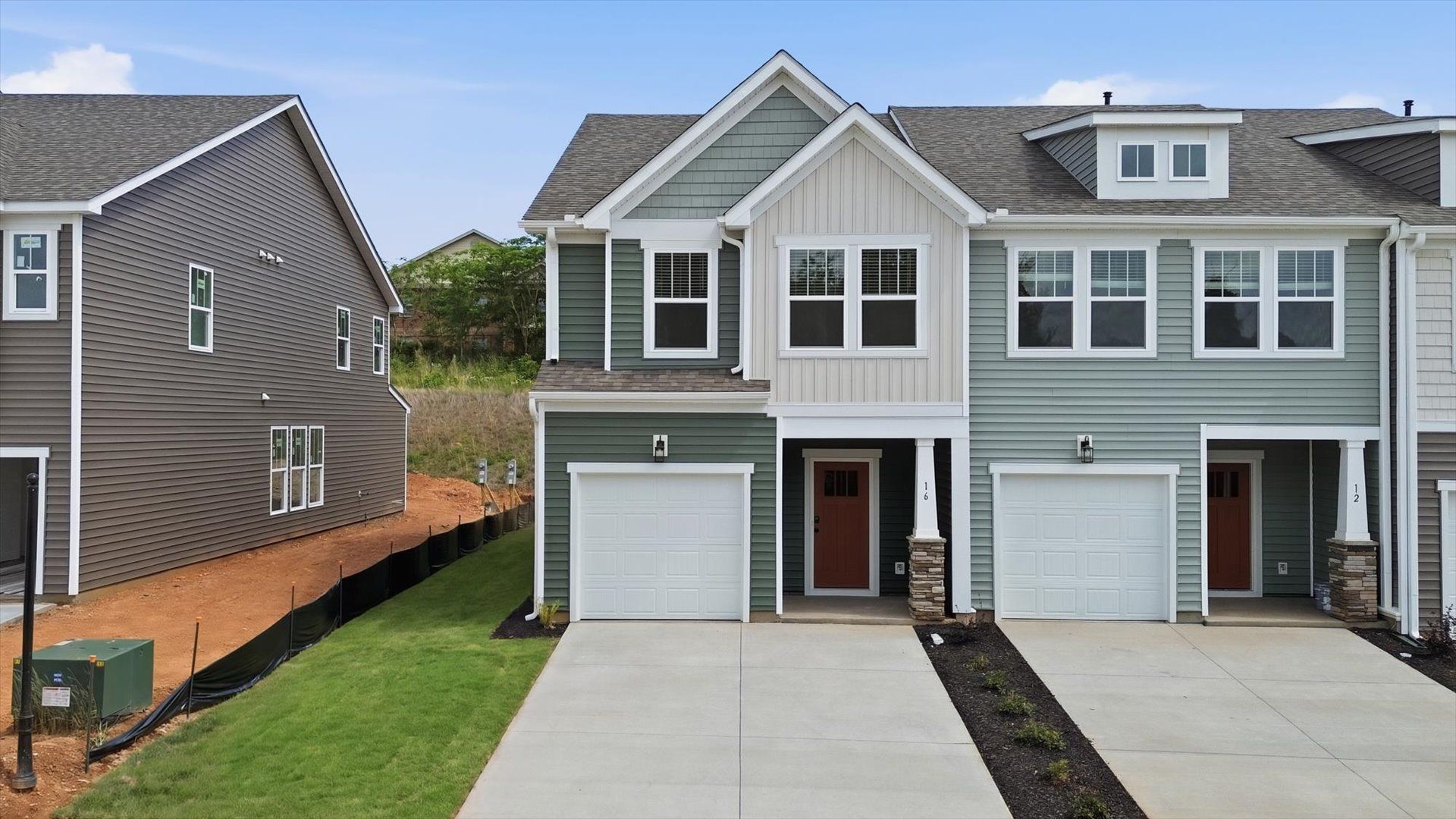 Elevated curb appeal with timeless stone accents and a welcoming covered entry:Top-notch exterior finishes in a select, well-established Greenville community near downtown