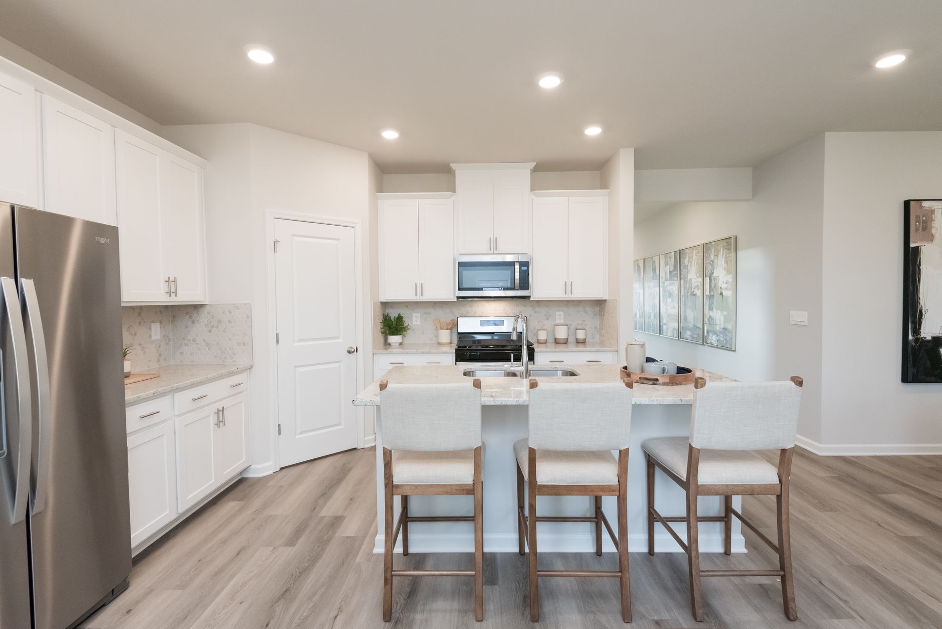 Kitchen:The Chatham floorplan with the Elemental White interior package modeled at Hamilton Crossing.