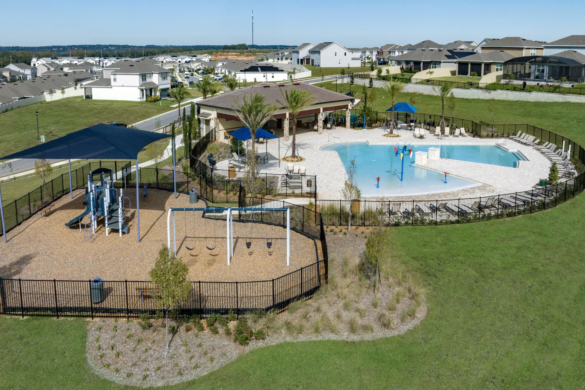 Ridgeview in Clermont, FL featuring modern new homes by Trinity Family Builders near Lake Louisa...:Ridgeview amenities include a resort-style swimming pool with splash pad and cabana, and a shaded playground